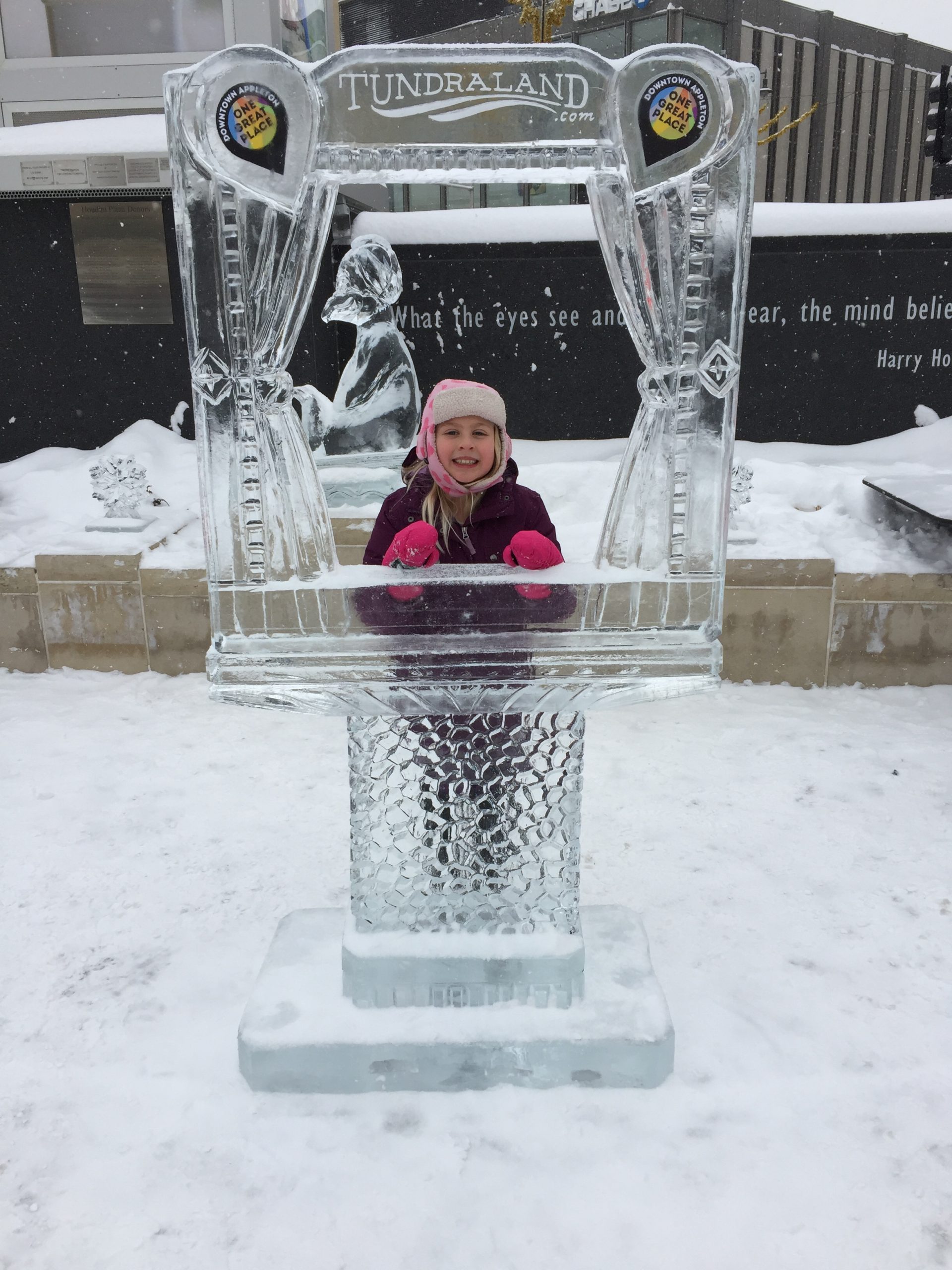 Young girl enjoying ice sculpture